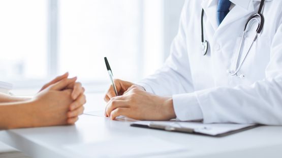 A doctor having a conversation with a nurse